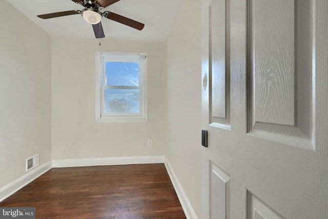 unfurnished room featuring dark hardwood / wood-style flooring and ceiling fan