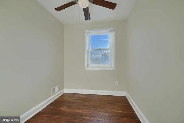 empty room featuring dark hardwood / wood-style floors and ceiling fan