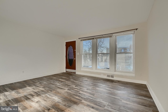 unfurnished room featuring hardwood / wood-style floors