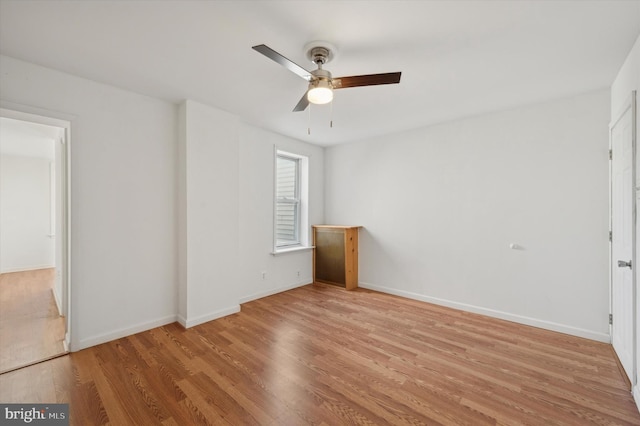 empty room featuring light hardwood / wood-style floors and ceiling fan