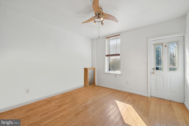 entrance foyer featuring light wood-type flooring and ceiling fan