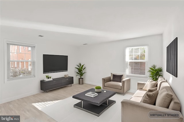 living room with light hardwood / wood-style flooring