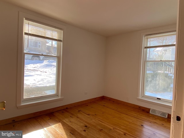 spare room with light wood-type flooring