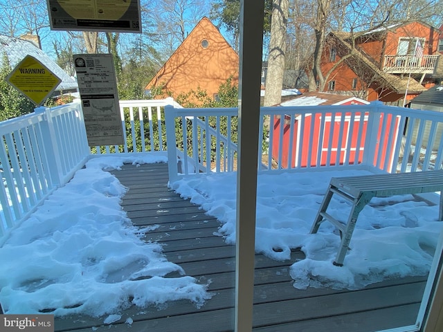 view of snow covered deck