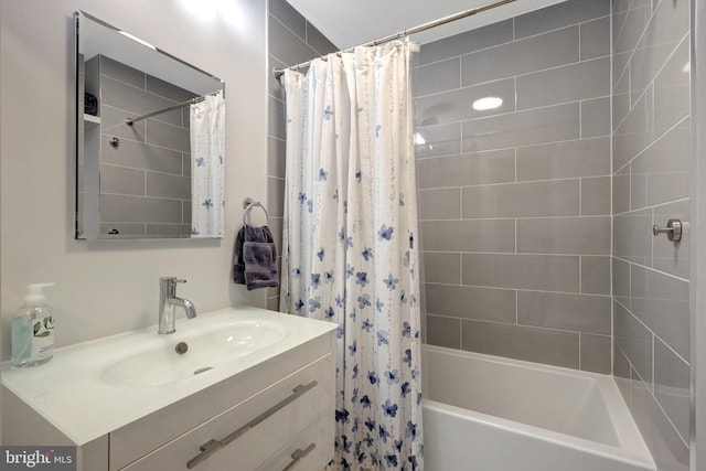 full bath featuring vanity and shower / bath combo with shower curtain