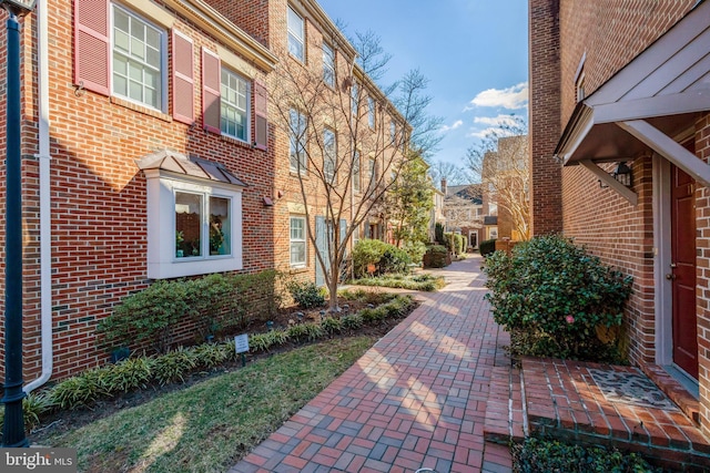 view of property exterior with brick siding