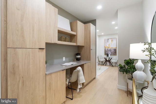 home office with light wood-type flooring