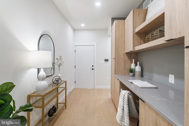 home office featuring light hardwood / wood-style flooring