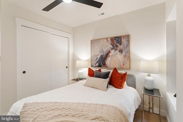 bedroom featuring ceiling fan and a closet