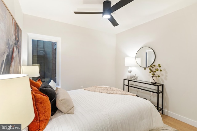 bedroom with ceiling fan and light hardwood / wood-style flooring