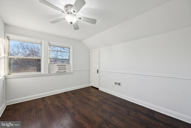 additional living space with lofted ceiling, dark wood-type flooring, and ceiling fan