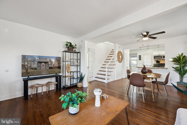 living room with hardwood / wood-style flooring and ceiling fan