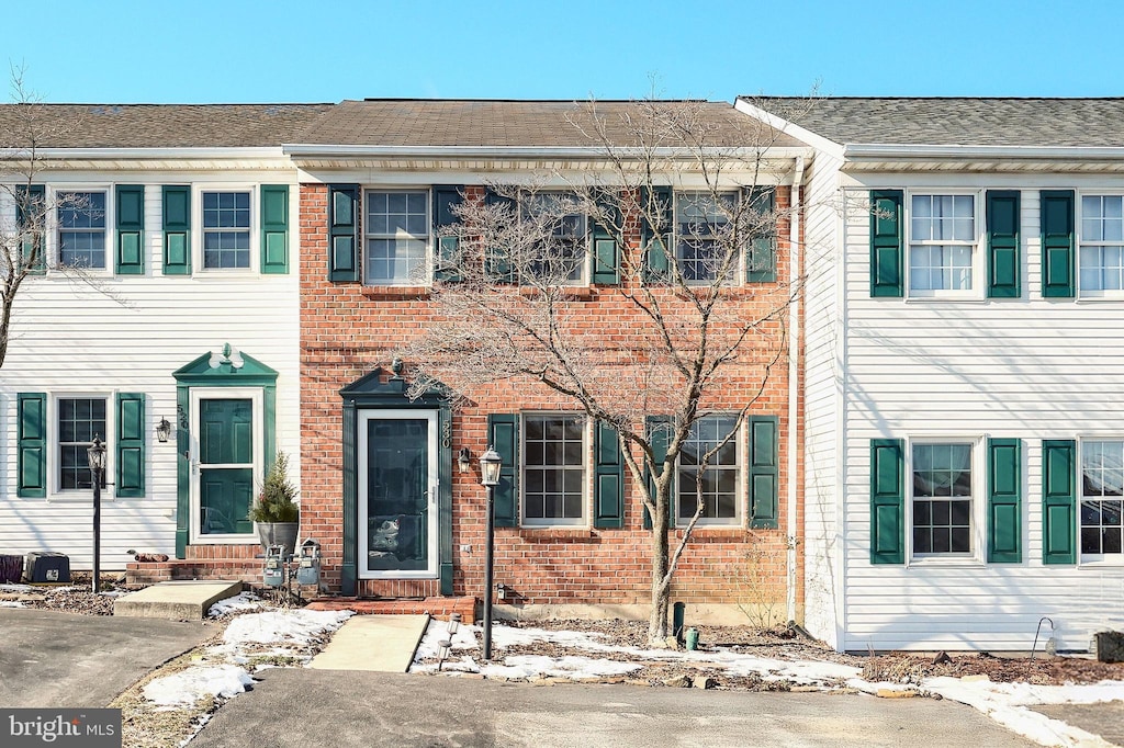 view of front of property with central AC unit