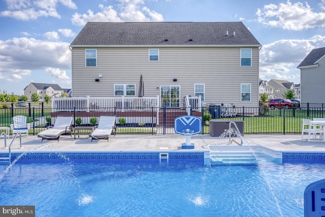 view of swimming pool featuring a patio area and a lawn