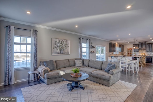 living room featuring light hardwood / wood-style floors and crown molding