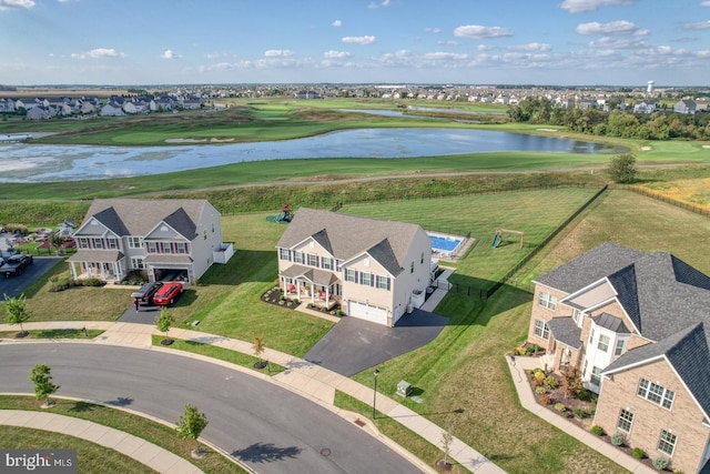 birds eye view of property with a water view