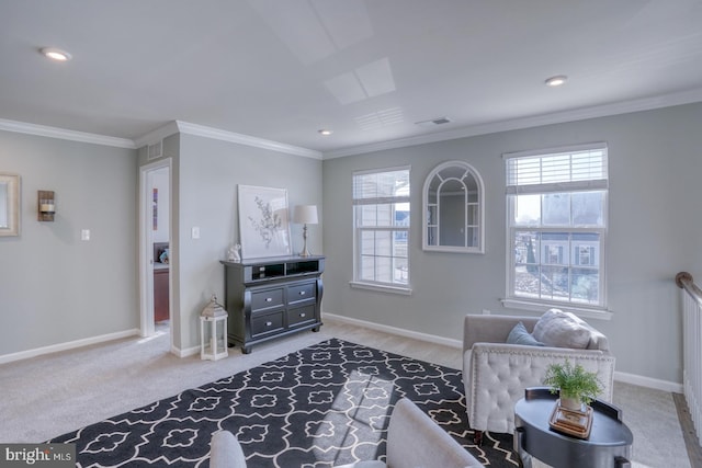 sitting room featuring crown molding, carpet flooring, and plenty of natural light