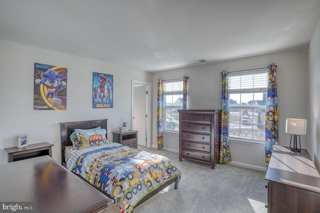 bedroom with light colored carpet