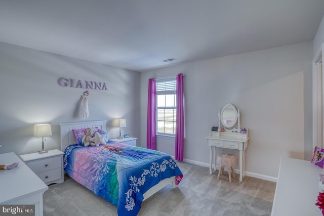 bedroom with light carpet