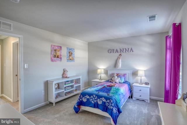 bedroom with light colored carpet