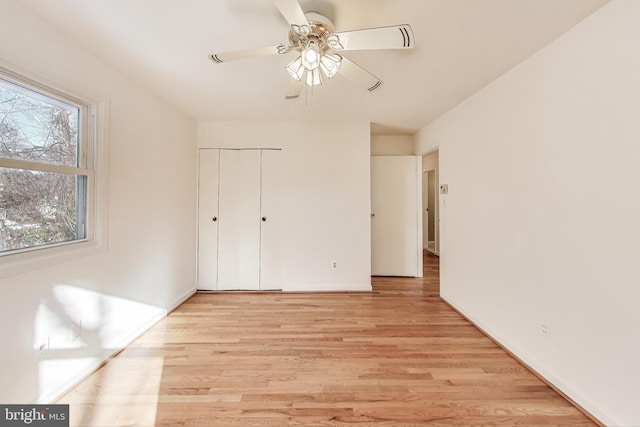 unfurnished bedroom featuring a closet, ceiling fan, and light hardwood / wood-style floors