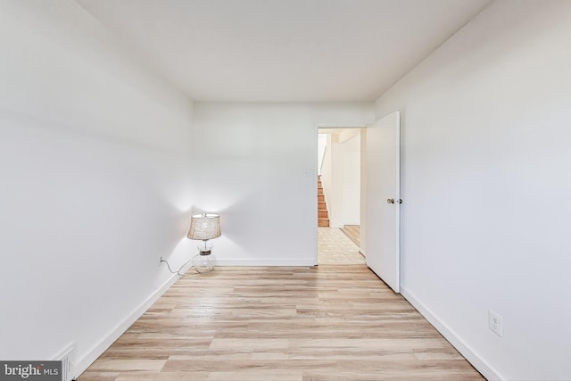 spare room with light hardwood / wood-style floors