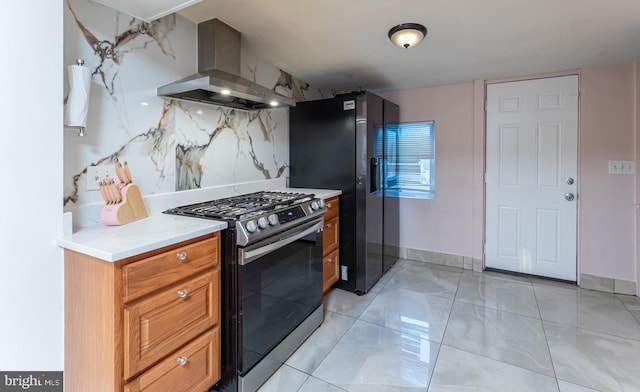 kitchen featuring tasteful backsplash, range hood, and stainless steel appliances