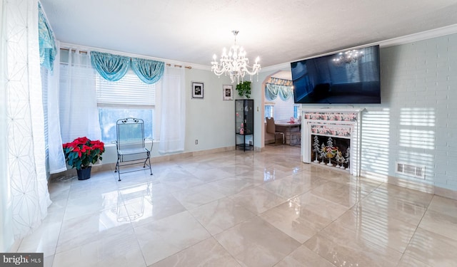 living room featuring ornamental molding and a notable chandelier