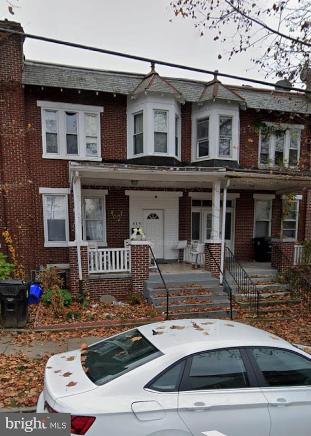 view of property featuring a porch