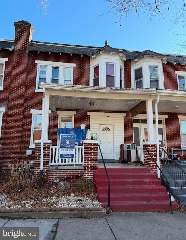 view of property with covered porch