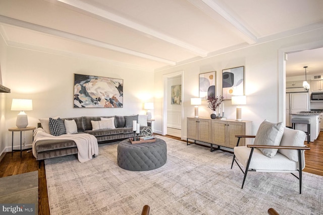 living room with beam ceiling and hardwood / wood-style floors