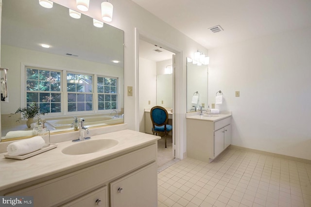 bathroom featuring tile patterned floors and vanity