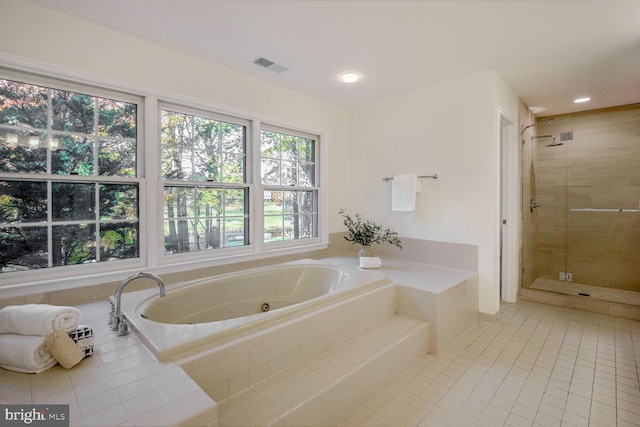 bathroom featuring shower with separate bathtub and tile patterned floors