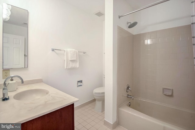 full bathroom featuring toilet, vanity, tile patterned floors, and tiled shower / bath