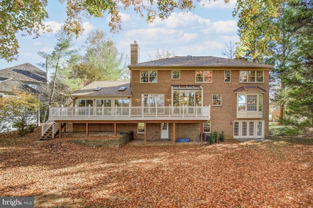 back of house with french doors and a deck