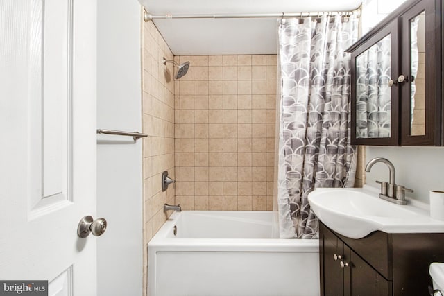 bathroom with vanity and shower / tub combo with curtain