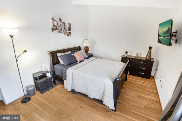 bedroom with light wood-type flooring