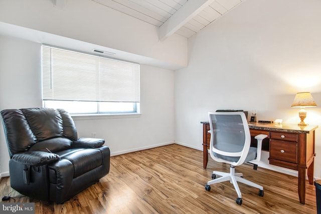 office space with wooden ceiling, light hardwood / wood-style floors, and vaulted ceiling with beams