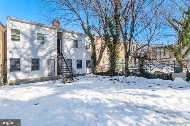 view of snow covered house