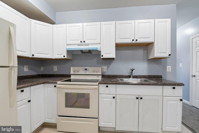 kitchen with sink, white appliances, and white cabinets