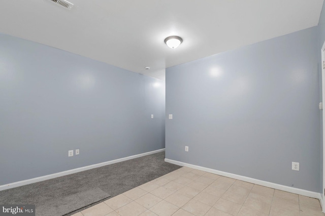 empty room with light colored carpet