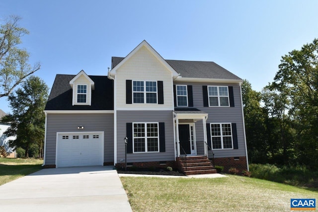 colonial inspired home with a front yard and a garage