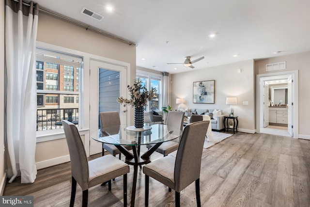 dining area featuring ceiling fan and light hardwood / wood-style floors