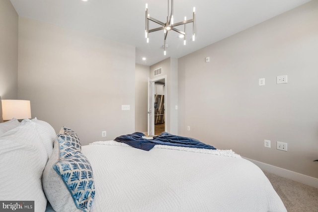 carpeted bedroom with a notable chandelier