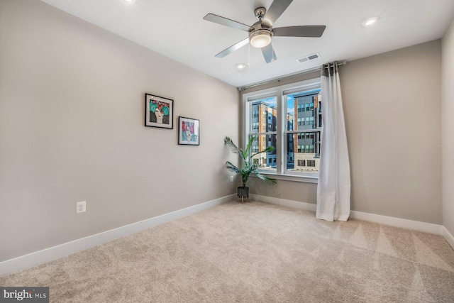 carpeted empty room with ceiling fan