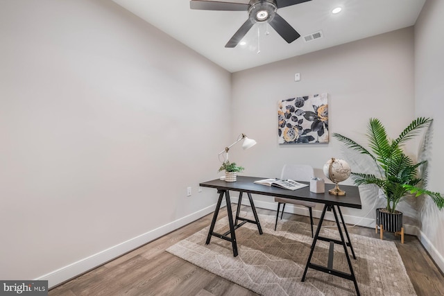 office space featuring lofted ceiling, ceiling fan, and hardwood / wood-style flooring