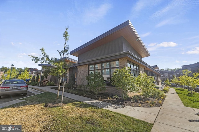 view of home's exterior with a yard