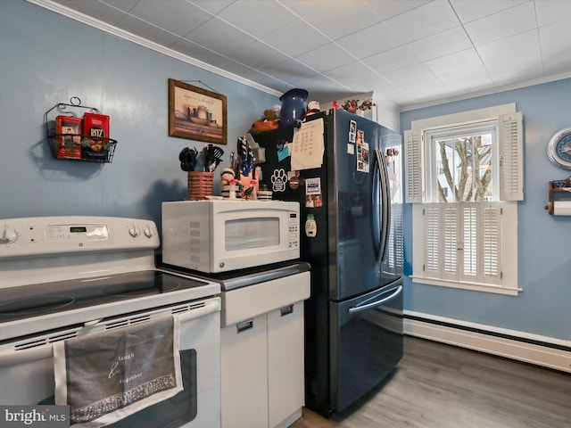 kitchen with white cabinets, white appliances, wood-type flooring, baseboard heating, and crown molding