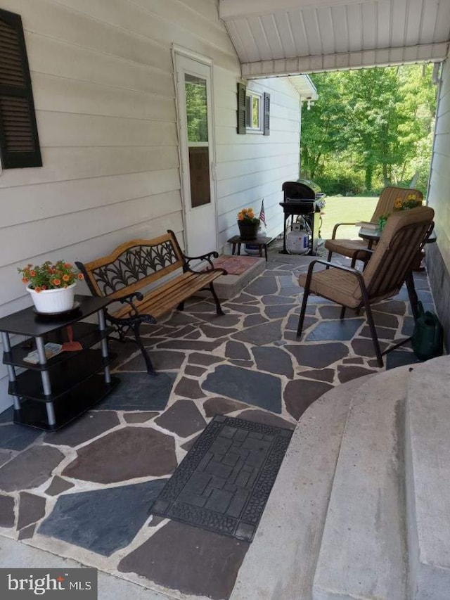 view of patio featuring a grill