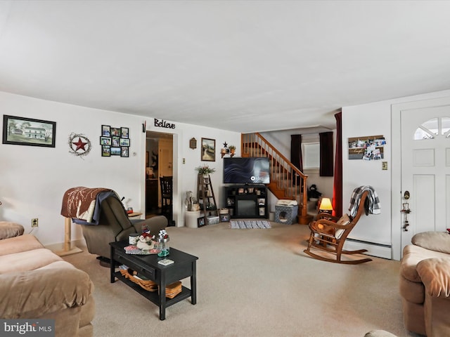 carpeted living room featuring baseboard heating